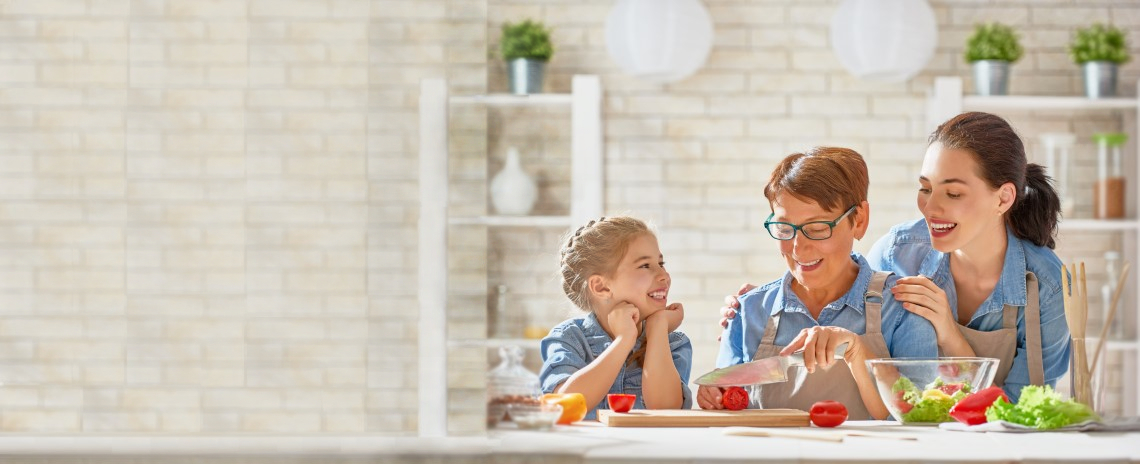 grandma, mom, and daughter cooking